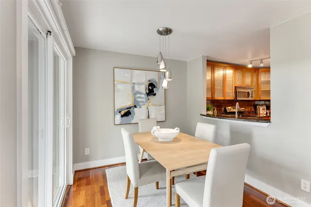 a dining room with furniture and window