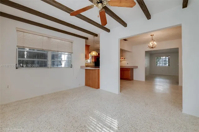 a view interior of a house with wooden floor and a kitchen space