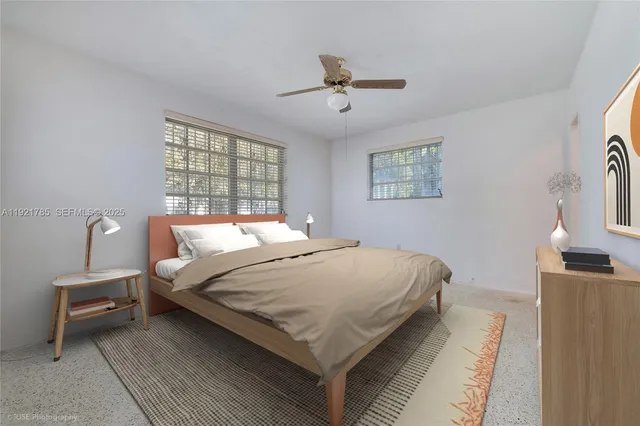 a bedroom with bed and window