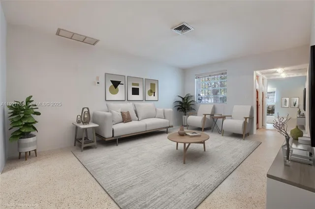 a living room with furniture and a couch