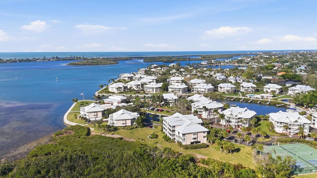 11000 Placida Road, Unit 302 Placida, FL 33946 - Photo 2 of 68 an aerial view of a residential houses with outdoor space