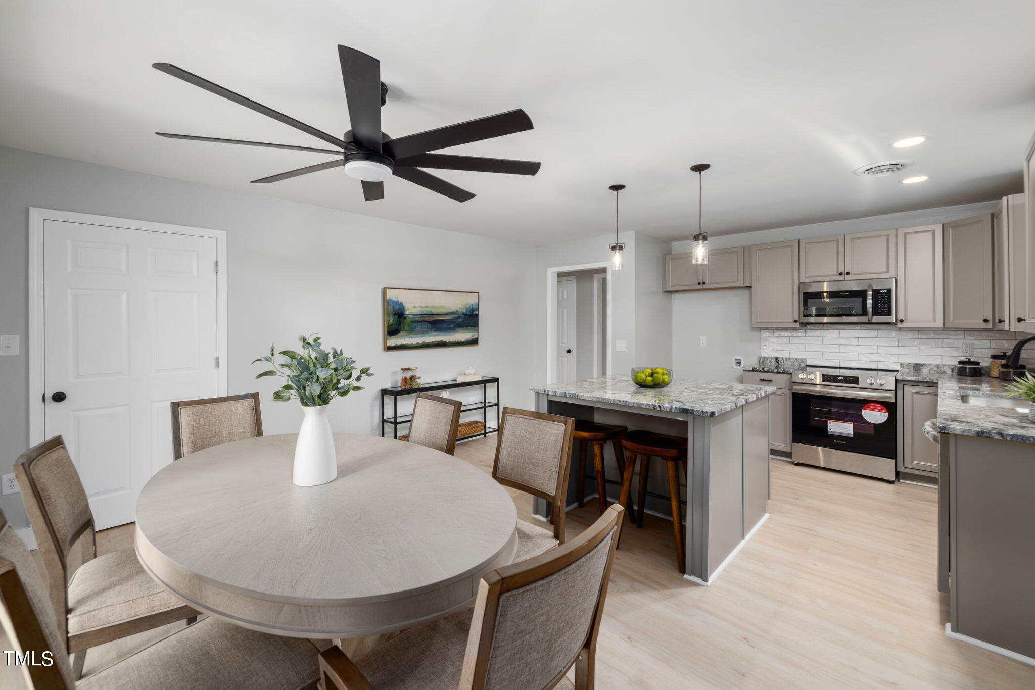 1200 Armstrong Circle Raleigh, NC 27610 - Photo 11 of 44 a dining room with furniture a window and kitchen view