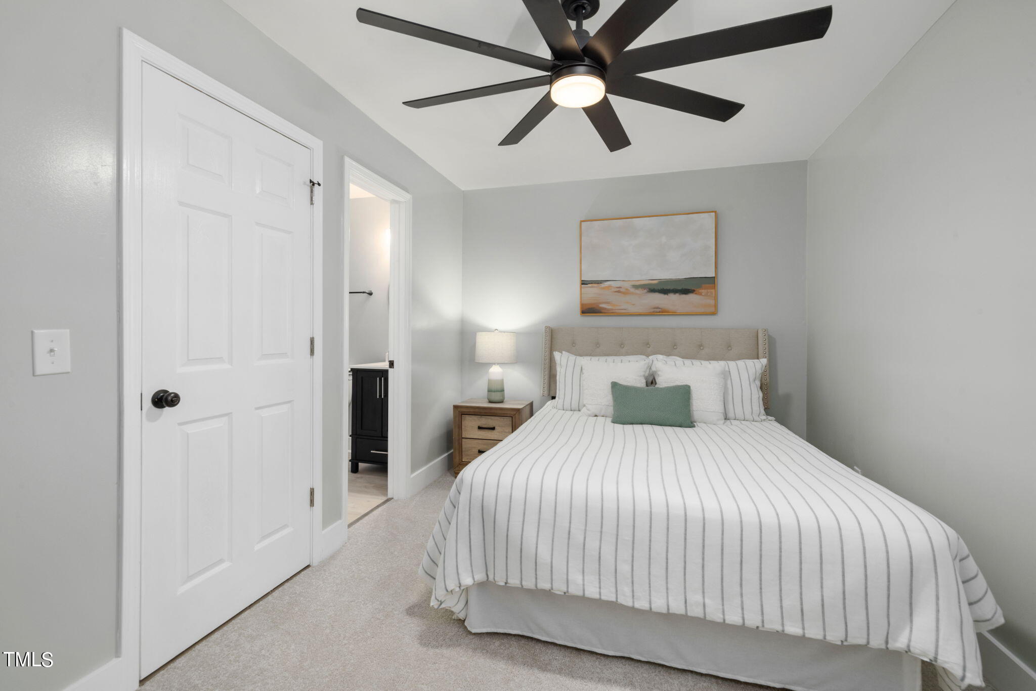 1200 Armstrong Circle Raleigh, NC 27610 - Photo 15 of 44 a bedroom with a large bed and a chandelier