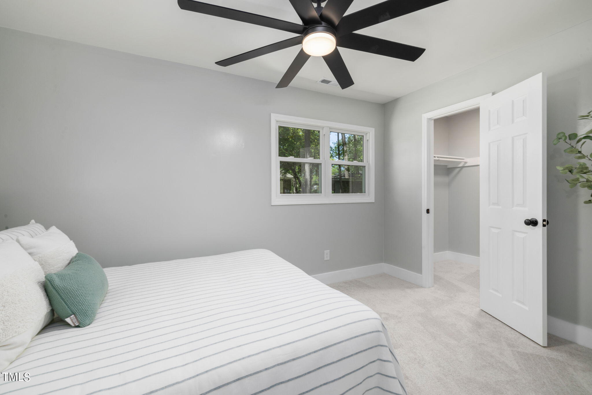 1200 Armstrong Circle Raleigh, NC 27610 - Photo 16 of 44 a bedroom with a bed and a window