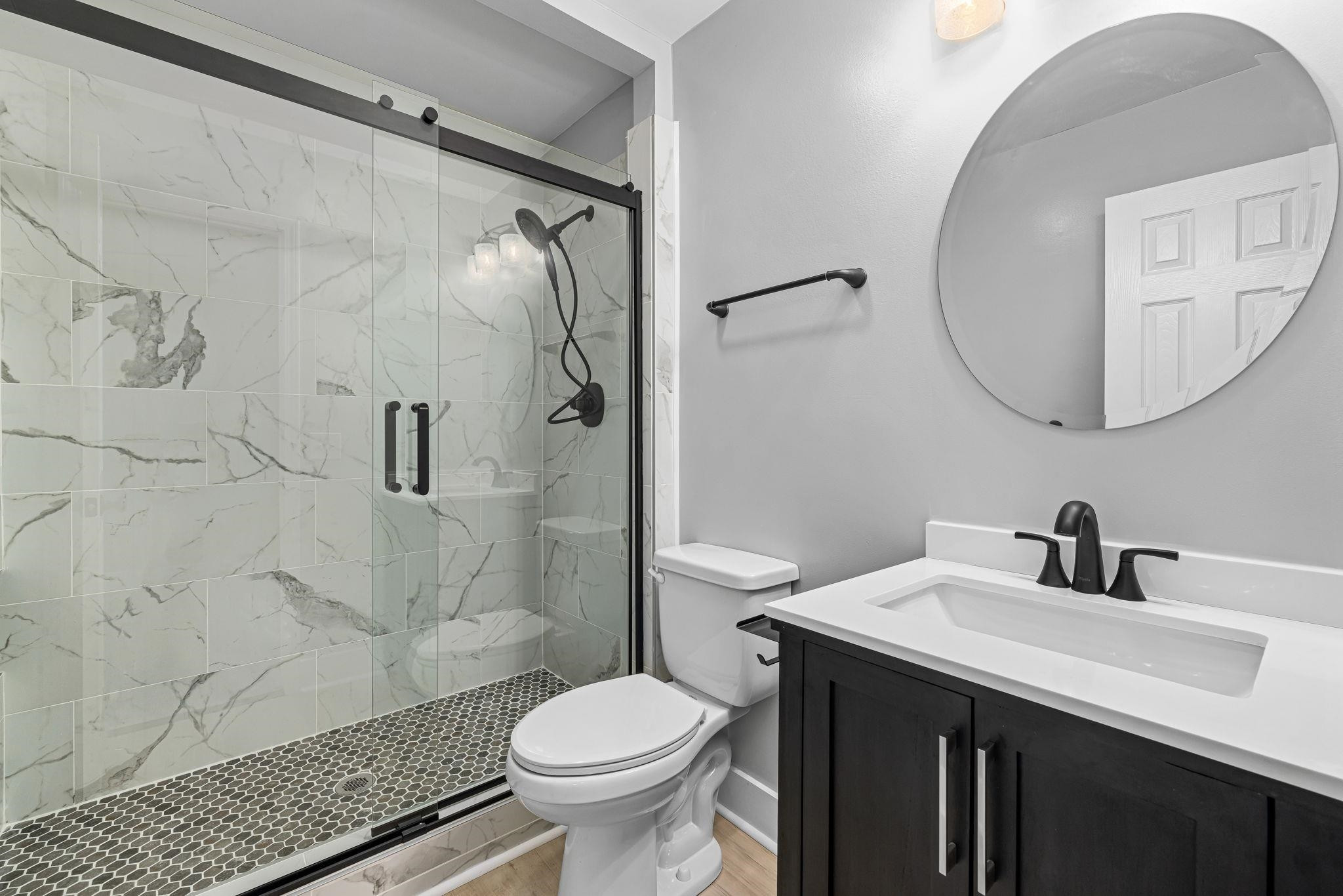 1200 Armstrong Circle Raleigh, NC 27610 - Photo 17 of 44 a bathroom with a sink toilet and shower