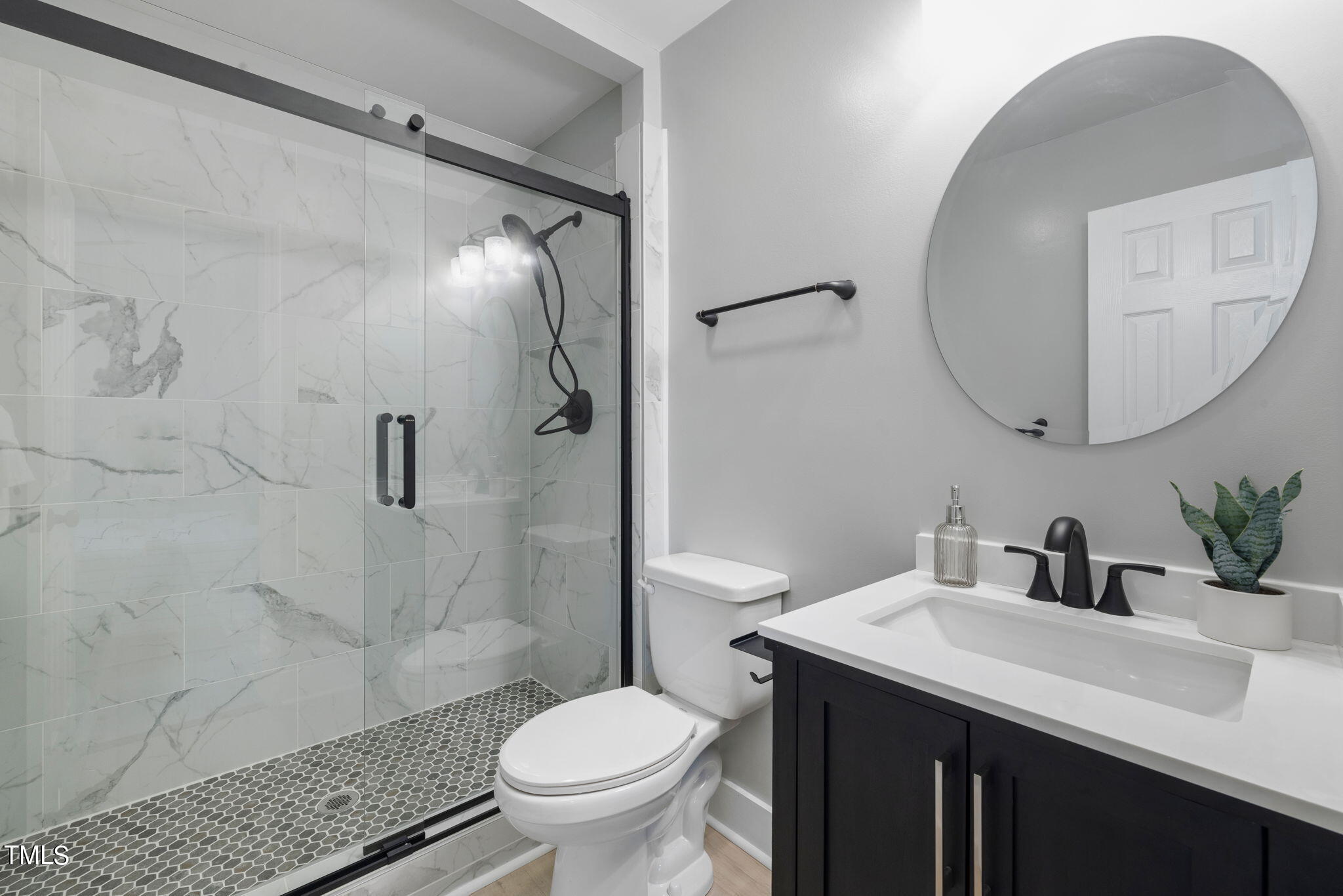 1200 Armstrong Circle Raleigh, NC 27610 - Photo 18 of 44 a bathroom with a sink toilet and shower