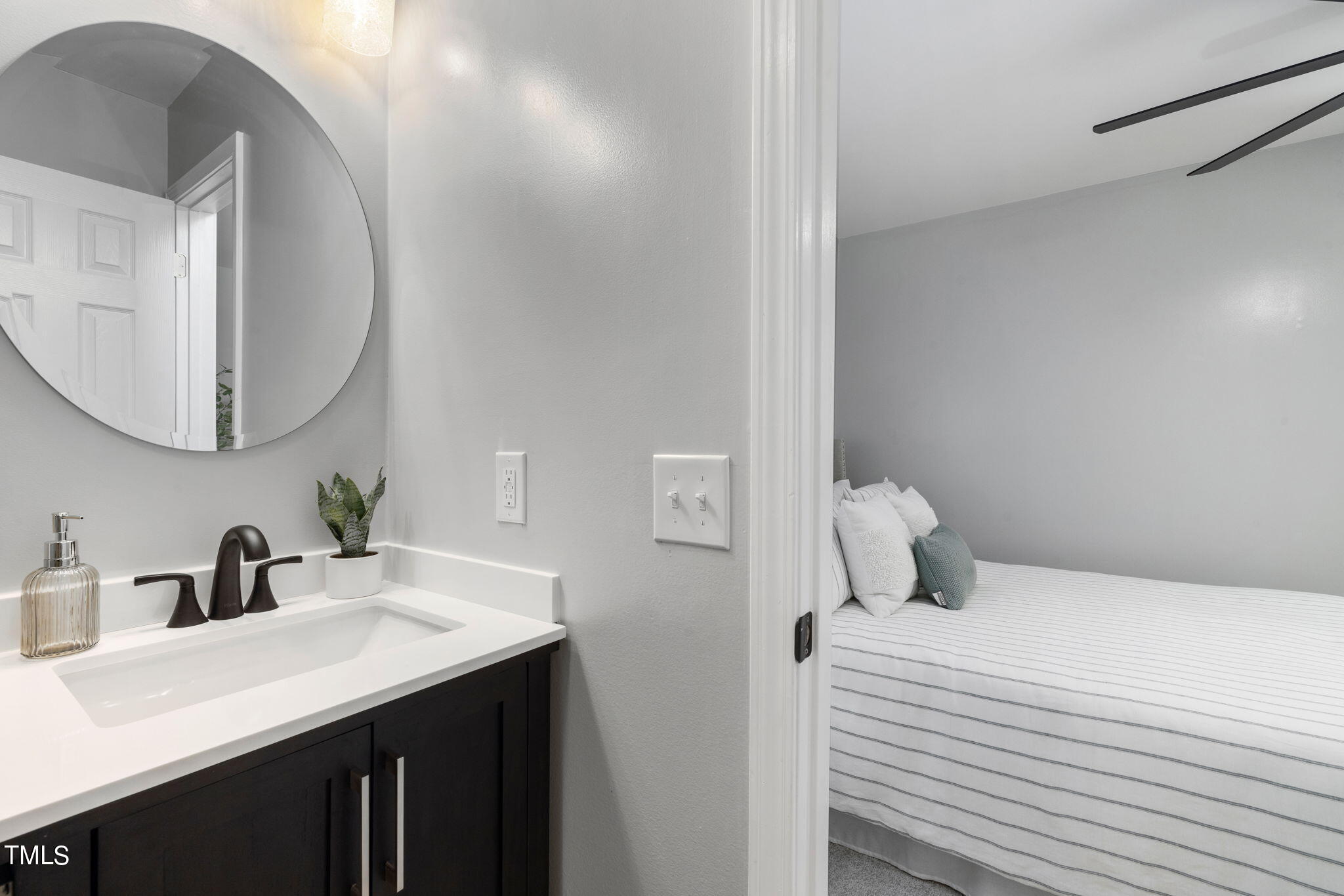 1200 Armstrong Circle Raleigh, NC 27610 - Photo 19 of 44 a bedroom with a sink and a mirror