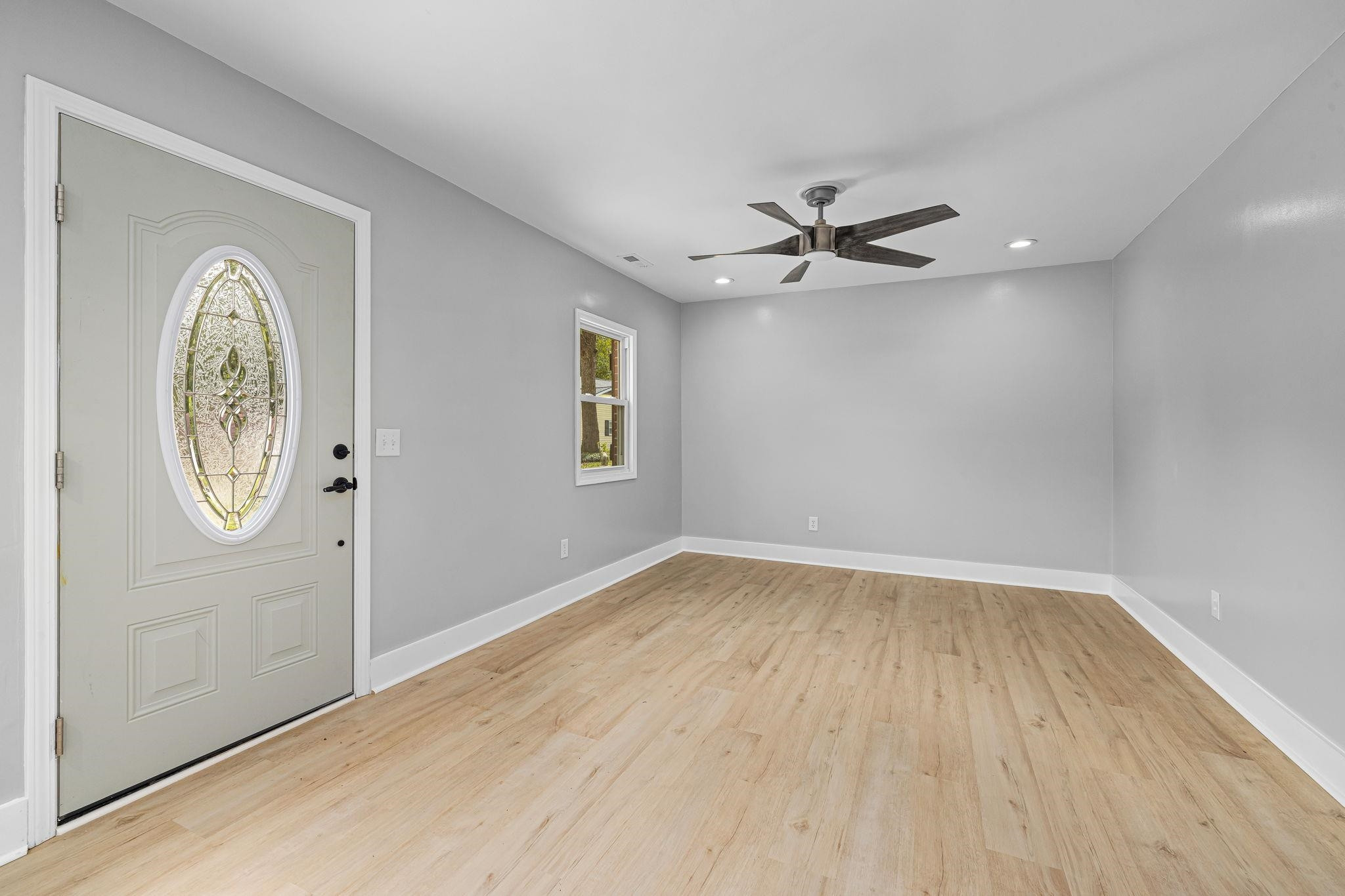 1200 Armstrong Circle Raleigh, NC 27610 - Photo 21 of 44 an empty room with windows and fan