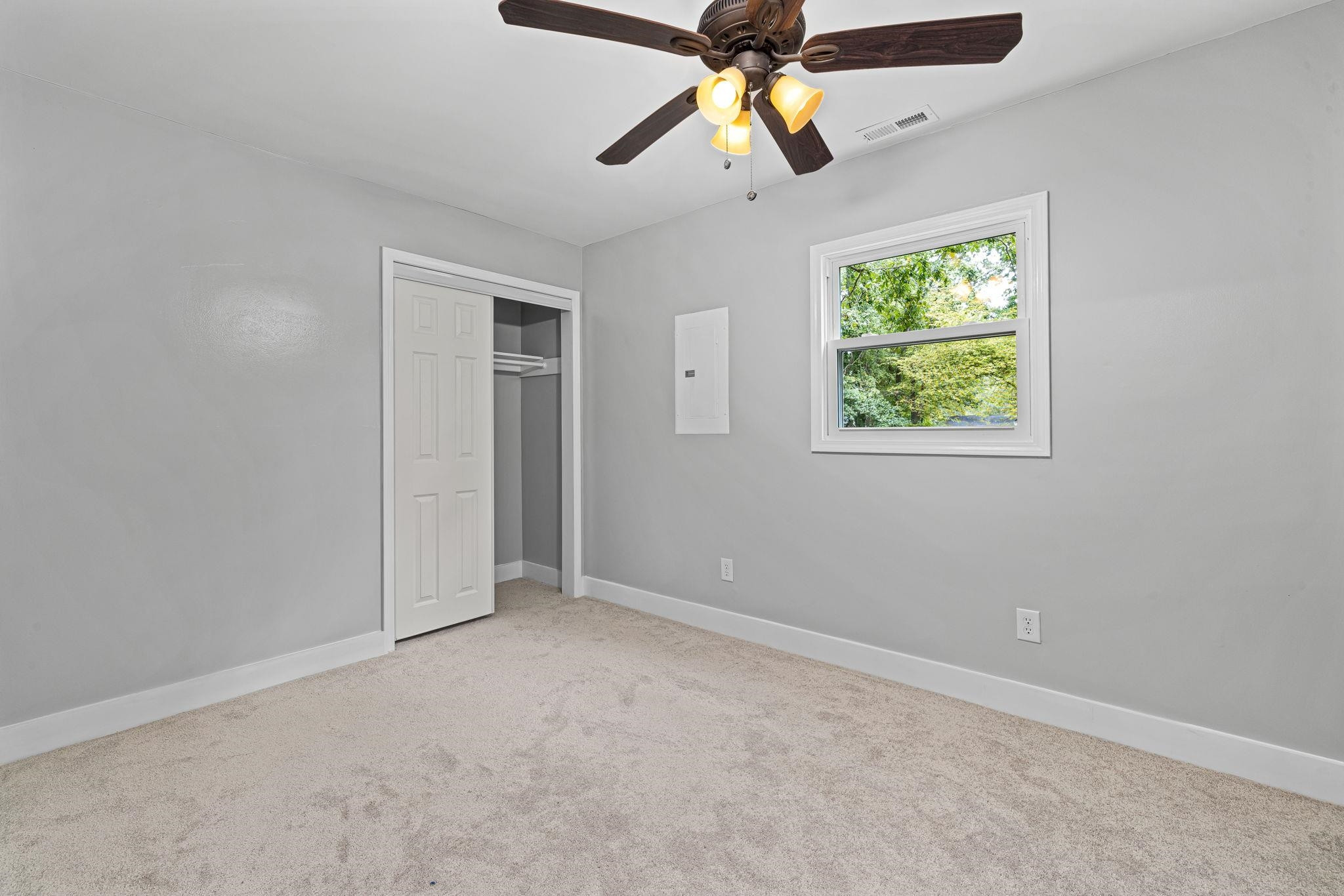 1200 Armstrong Circle Raleigh, NC 27610 - Photo 24 of 44 an empty room with window and chandelier fan