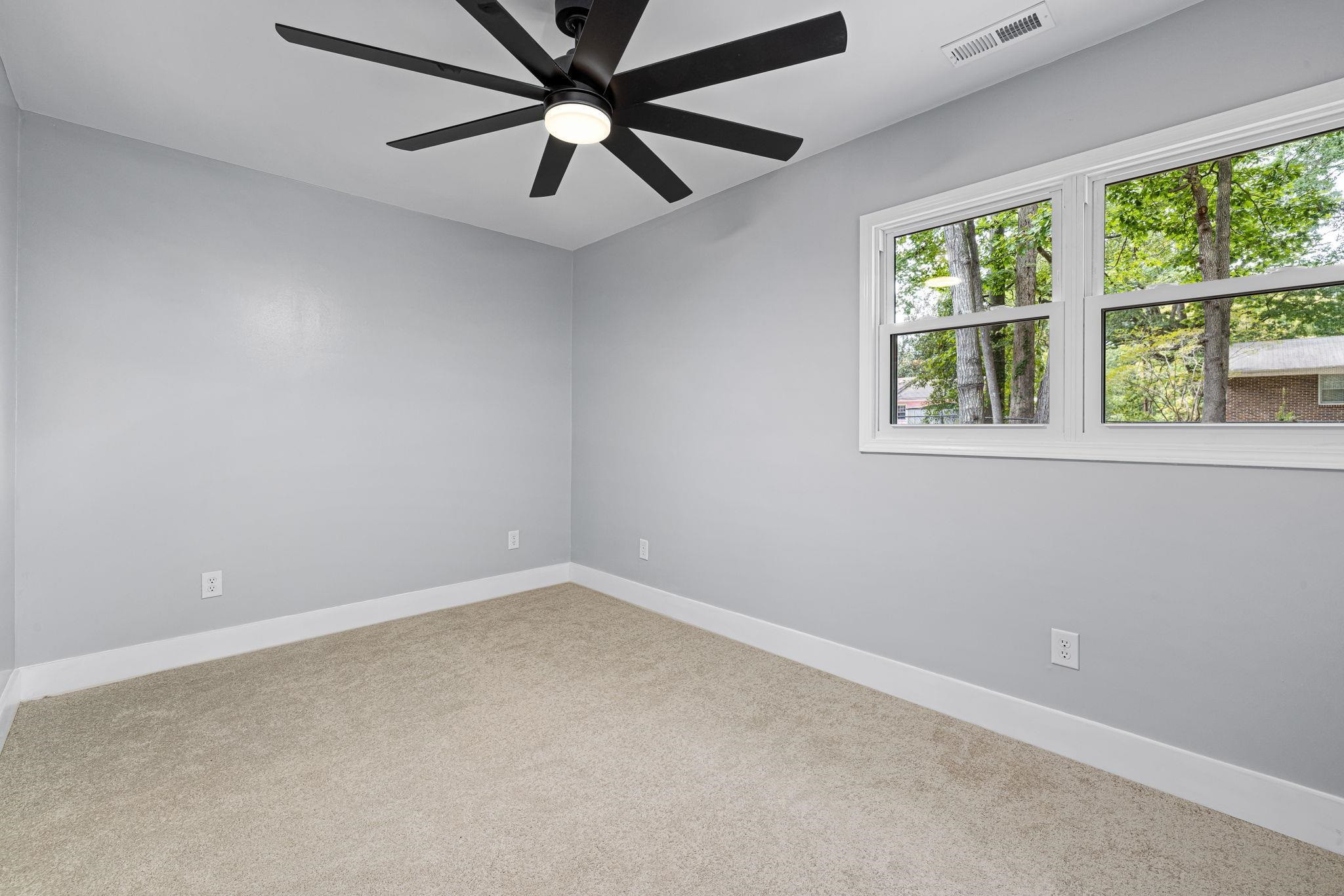 1200 Armstrong Circle Raleigh, NC 27610 - Photo 29 of 44 an empty room with a window and a fan