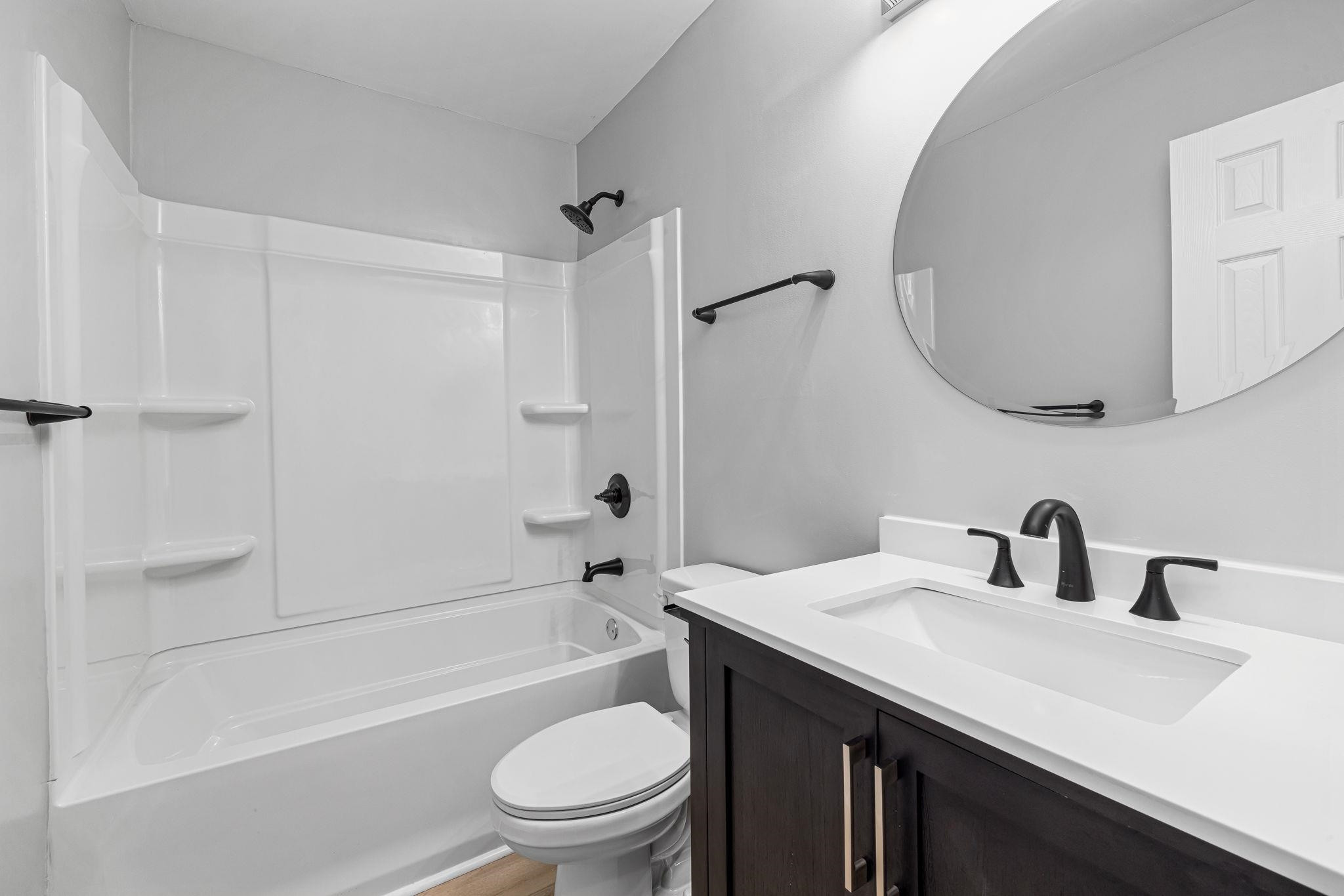1200 Armstrong Circle Raleigh, NC 27610 - Photo 32 of 44 a bathroom with a granite countertop sink toilet and shower