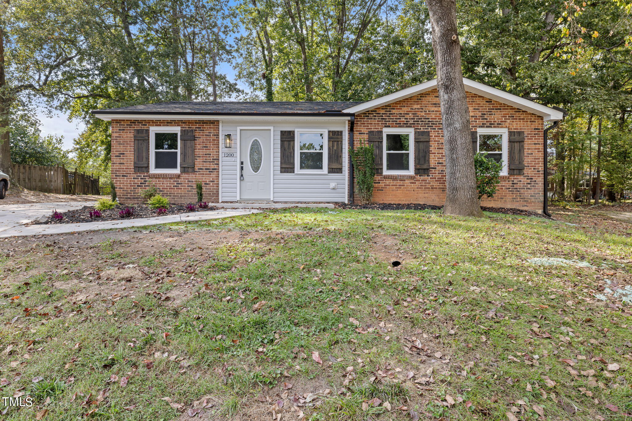 1200 Armstrong Circle Raleigh, NC 27610 - Photo 41 of 44 a front view of a house with a garden