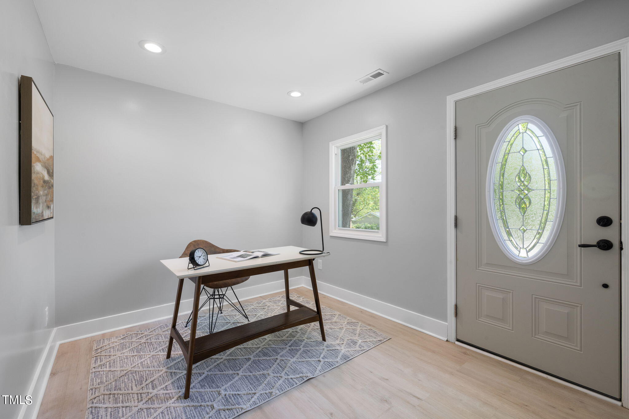 1200 Armstrong Circle Raleigh, NC 27610 - Photo 5 of 44 a workspace with furniture and a window
