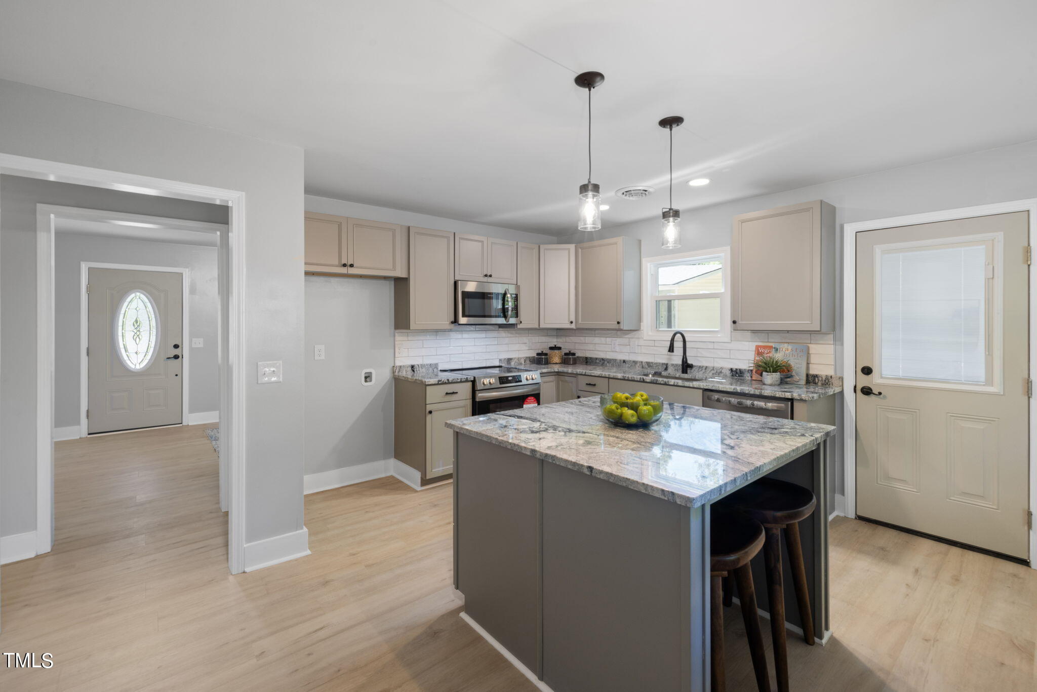 1200 Armstrong Circle Raleigh, NC 27610 - Photo 8 of 44 a kitchen with stainless steel appliances granite countertop a sink stove and refrigerator
