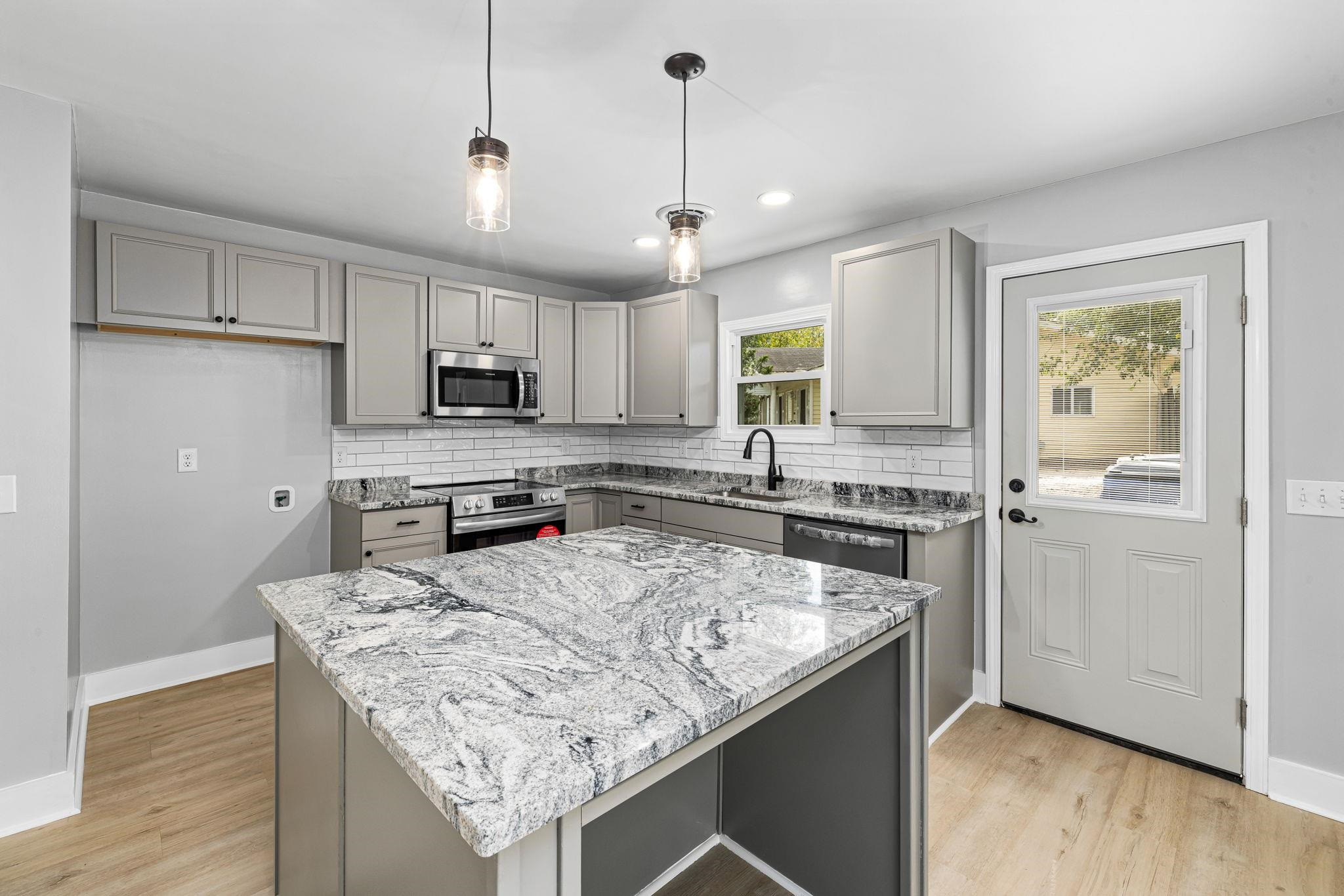 1200 Armstrong Circle Raleigh, NC 27610 - Photo 10 of 44 a kitchen with stainless steel appliances granite countertop a sink stove and refrigerator