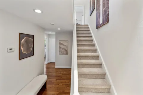 a view of an entryway with wooden floor