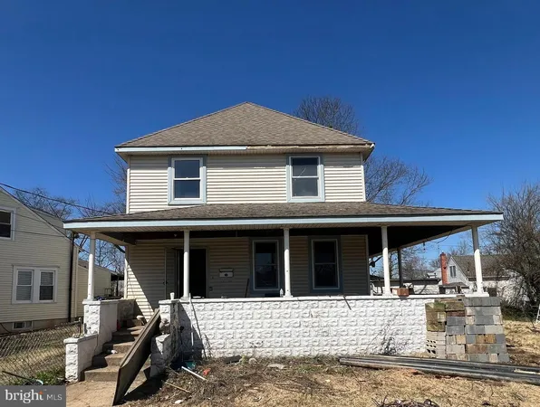 a front view of a house with yard porch and furniture