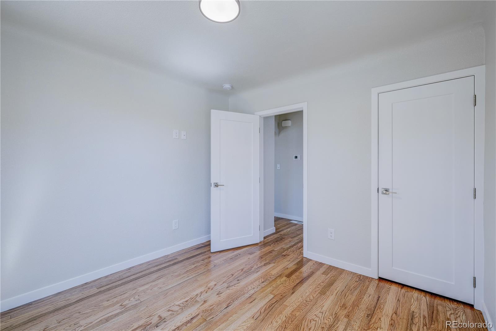 2932 Chase Street Wheat Ridge, CO 80214 - Photo 15 of 30 a view of an empty room and wooden floor