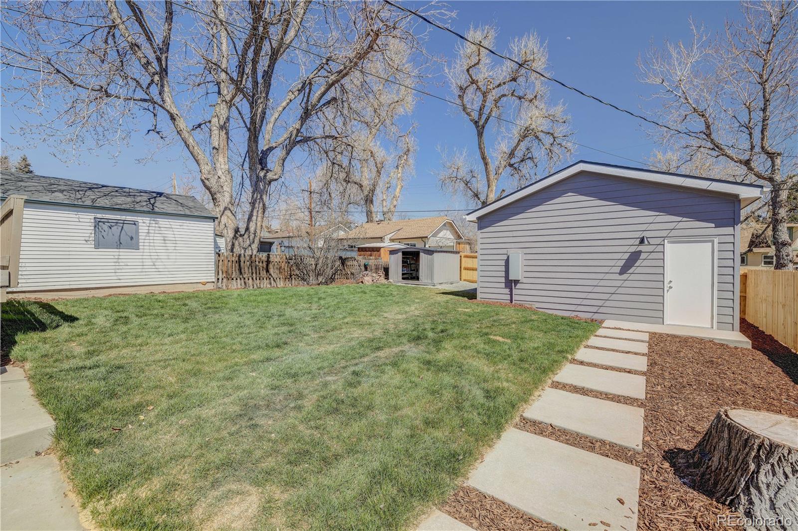 2932 Chase Street Wheat Ridge, CO 80214 - Photo 27 of 30 a front view of a house with a yard