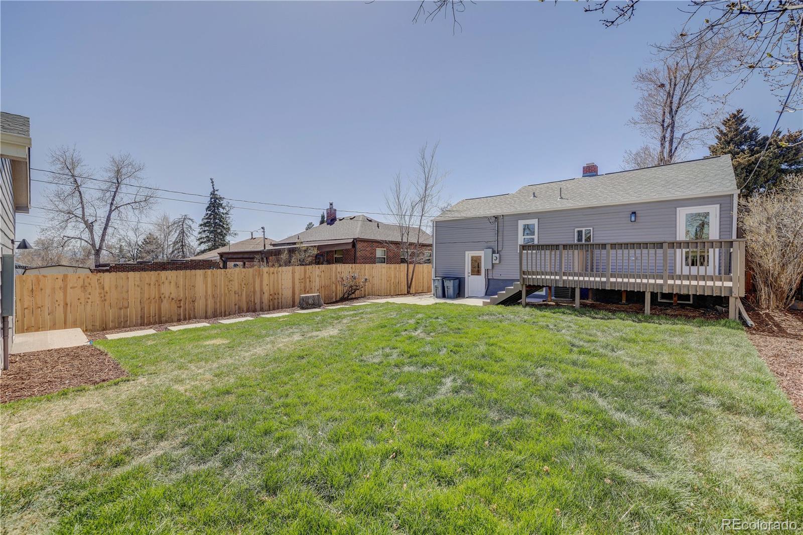 2932 Chase Street Wheat Ridge, CO 80214 - Photo 29 of 30 a view of a backyard with wooden fence