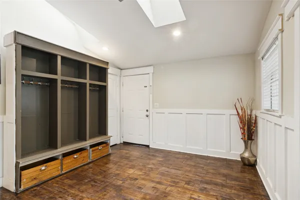 a bedroom with a bed and a television