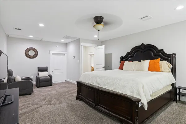 a bathroom with a bathtub a sink and a window