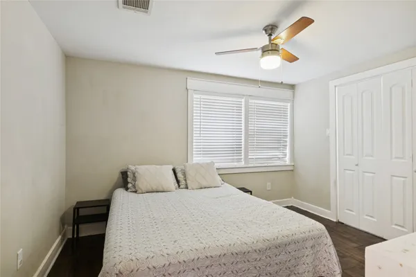 a bedroom with a bed and window