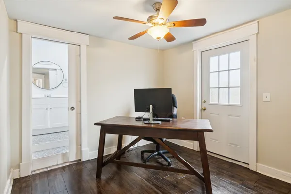 a bathroom with a toilet a sink and a mirror