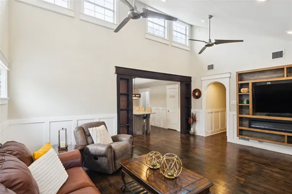 a large kitchen with a table and chairs in it