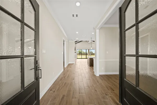 a view of gallery with wooden floor