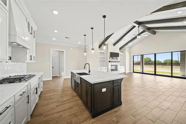a kitchen with stainless steel appliances granite countertop a stove and a center island