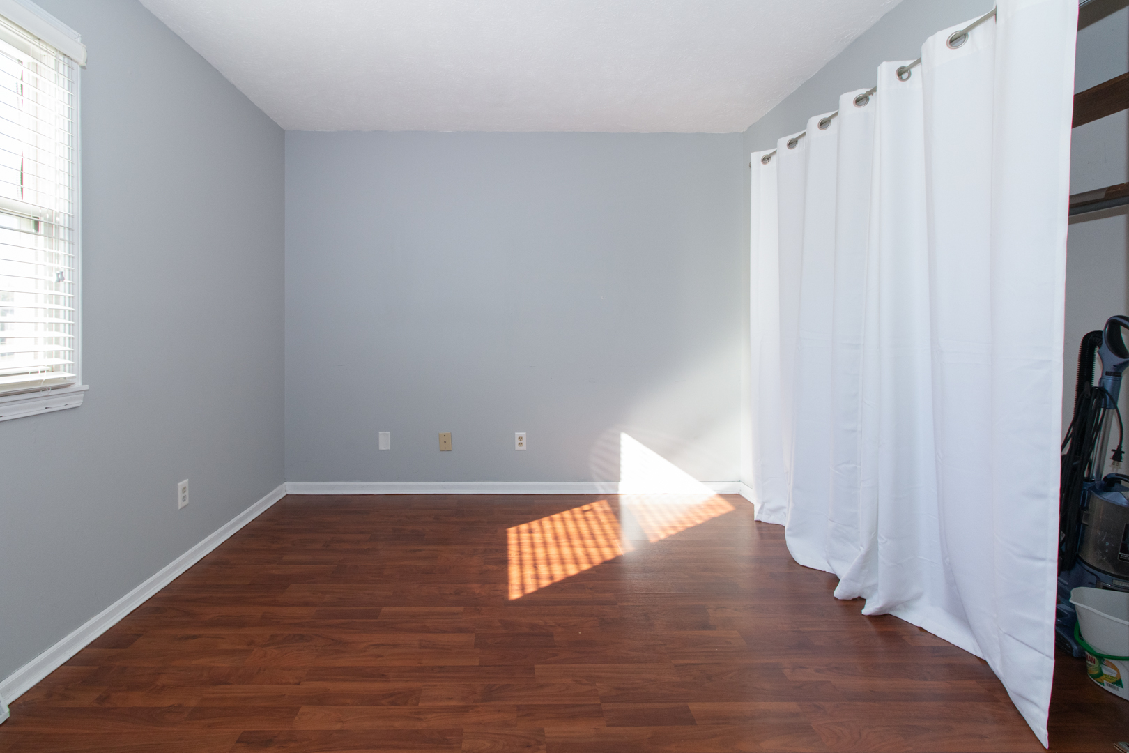 1705 Rockingham Drive, Unit 3 Normal, IL 61761 - Photo 14 of 31 a view of an empty room with wooden floor and a window
