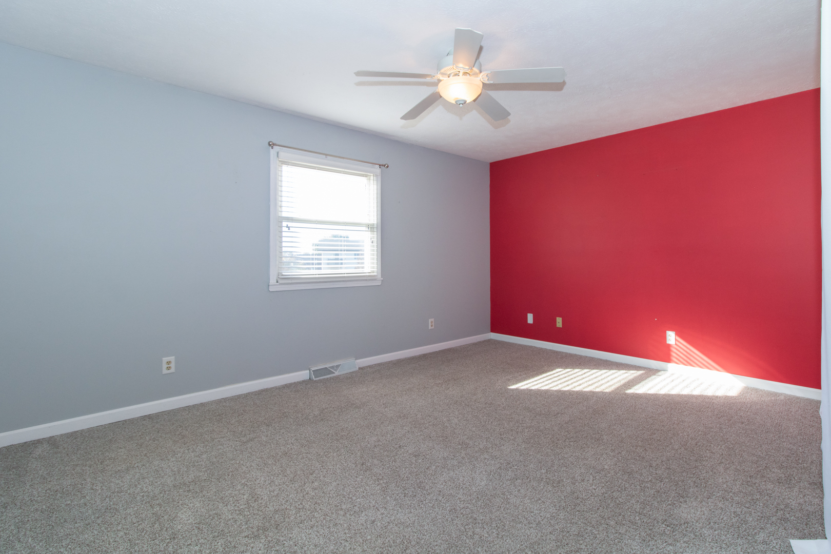 1705 Rockingham Drive, Unit 3 Normal, IL 61761 - Photo 16 of 31 an empty room with windows and ceiling fan