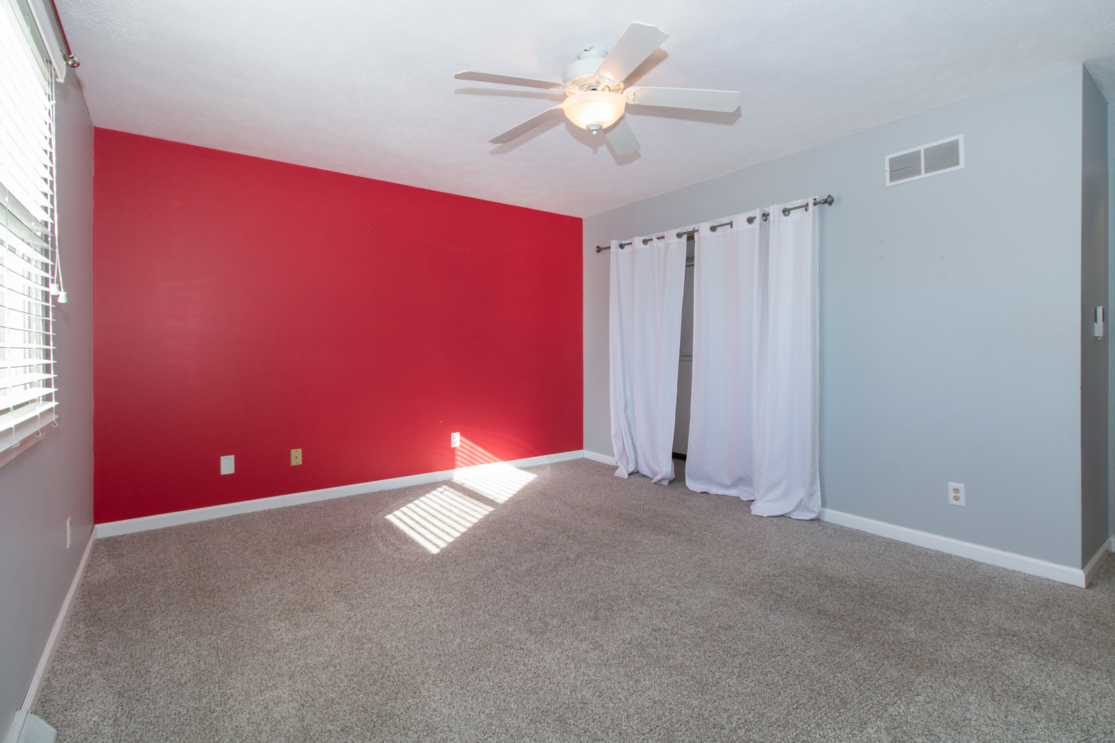 1705 Rockingham Drive, Unit 3 Normal, IL 61761 - Photo 18 of 31 an empty room with windows and fan