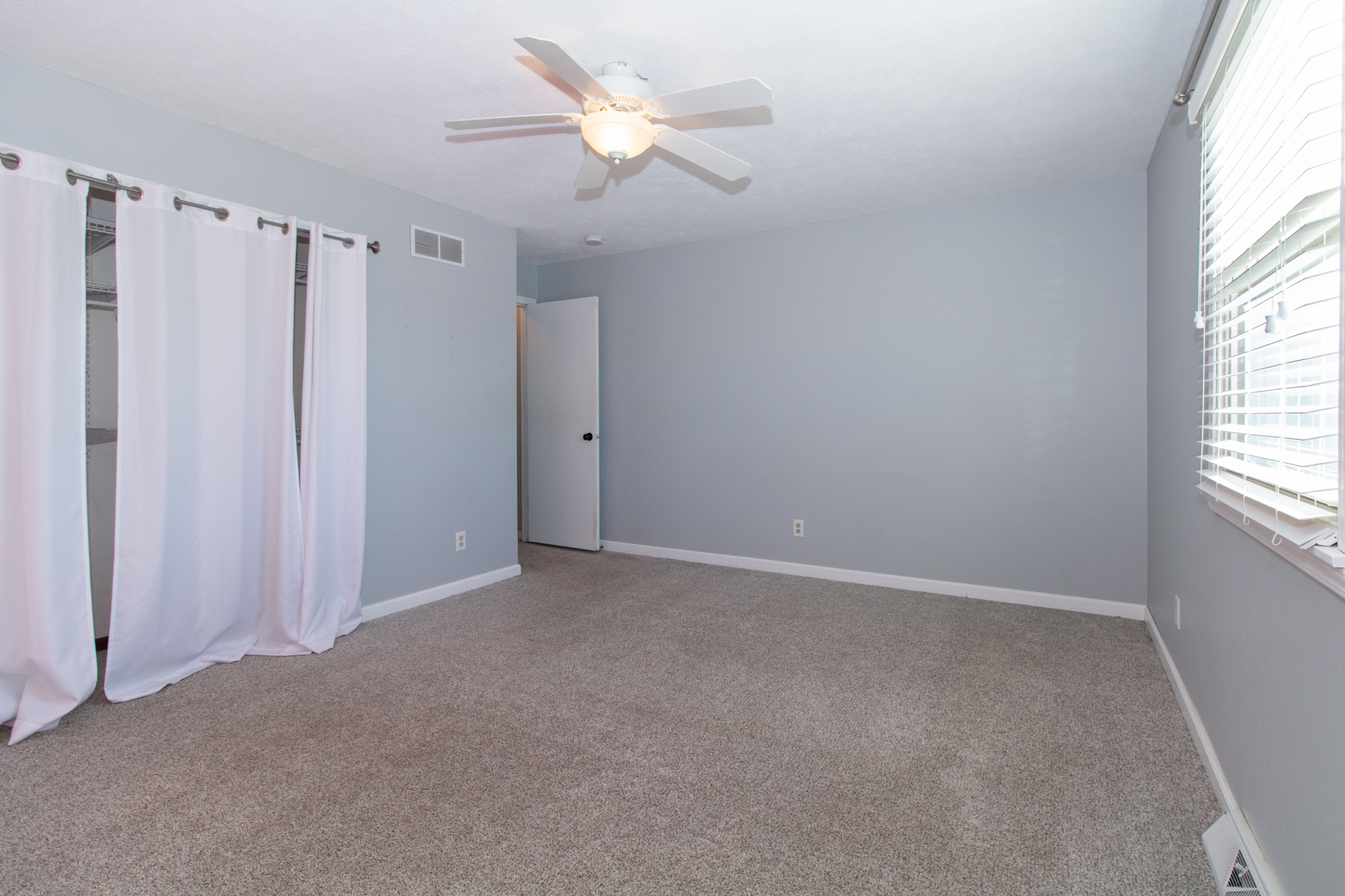 1705 Rockingham Drive, Unit 3 Normal, IL 61761 - Photo 19 of 31 an empty room with windows and fan