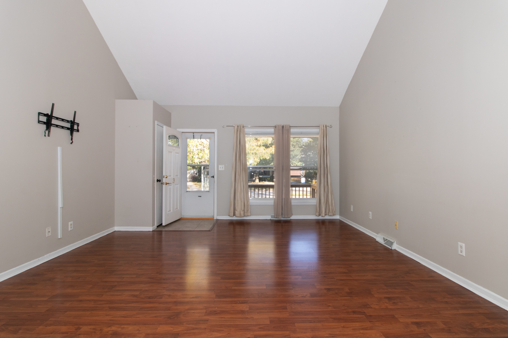 1705 Rockingham Drive, Unit 3 Normal, IL 61761 - Photo 6 of 31 a view of an empty room with wooden floor and a window