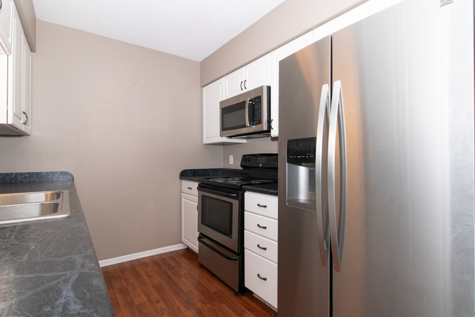 1705 Rockingham Drive, Unit 3 Normal, IL 61761 - Photo 9 of 31 a kitchen with stainless steel appliances granite countertop a refrigerator stove and microwave