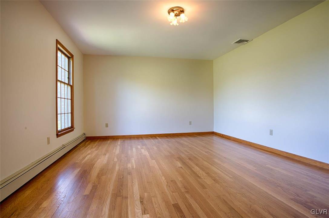 187 Nolf Road Nazareth, PA 18064 - Photo 8 of 33 a view of an empty room with wooden floor and a window