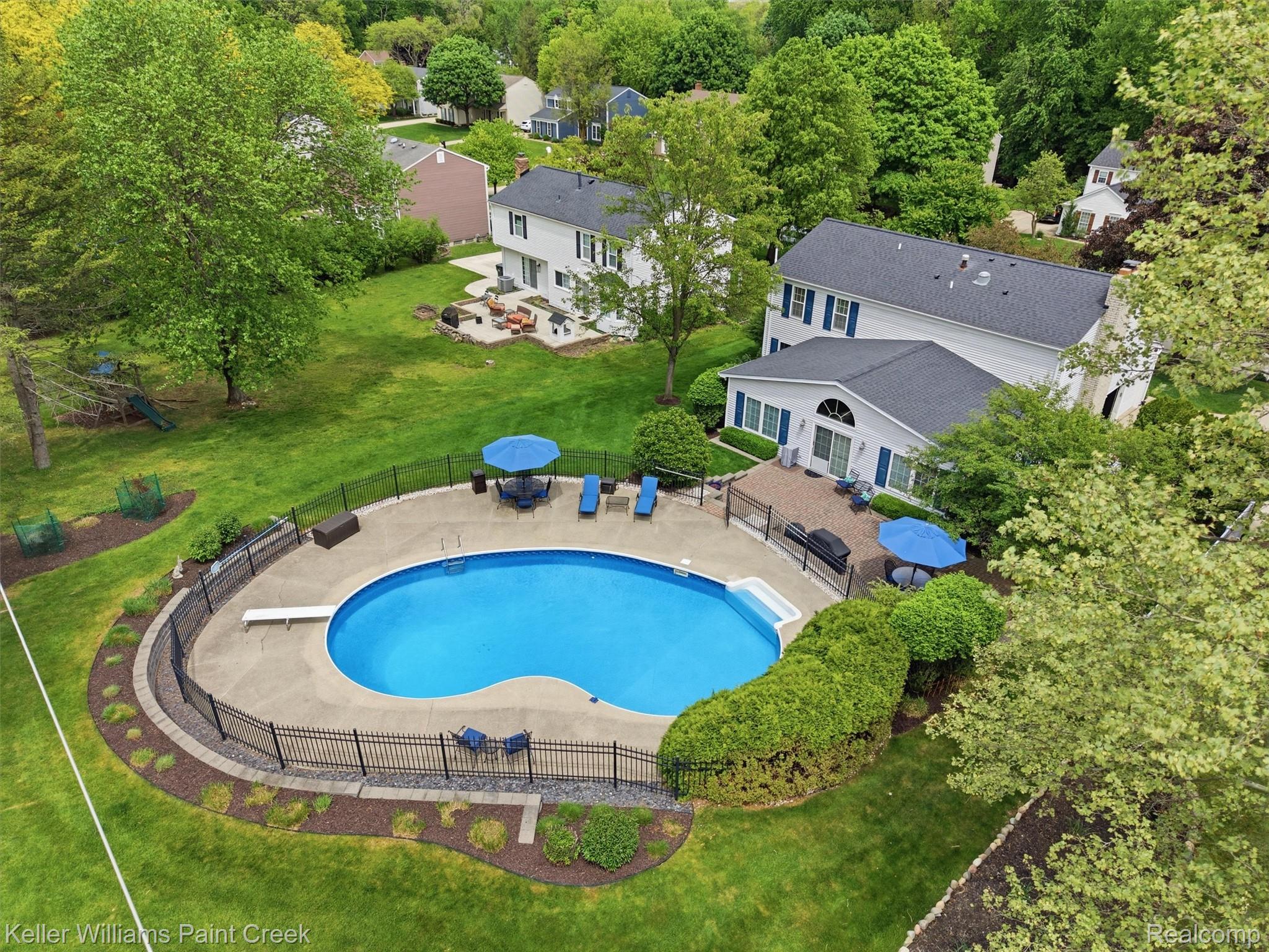 1351 West Fairview Lane Rochester, MI 48306 - Photo 8 of 65 View of pool featuring patio surround and a playground
