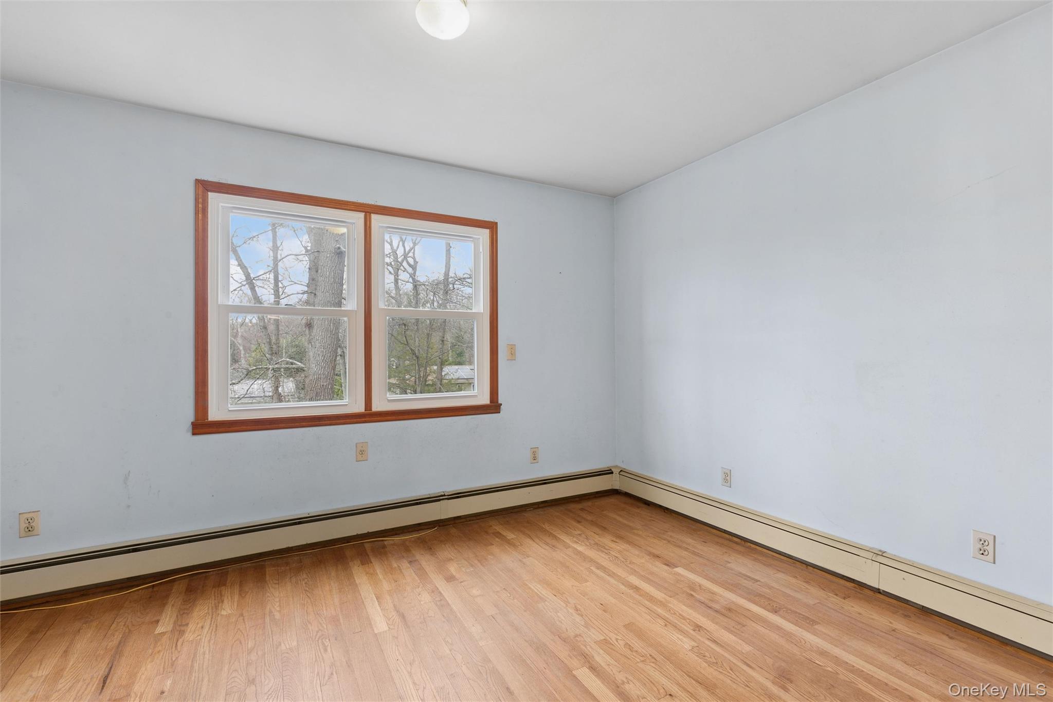 49 Overhill Road Wading River, NY 11792 - Photo 17 of 27 an empty room with a window