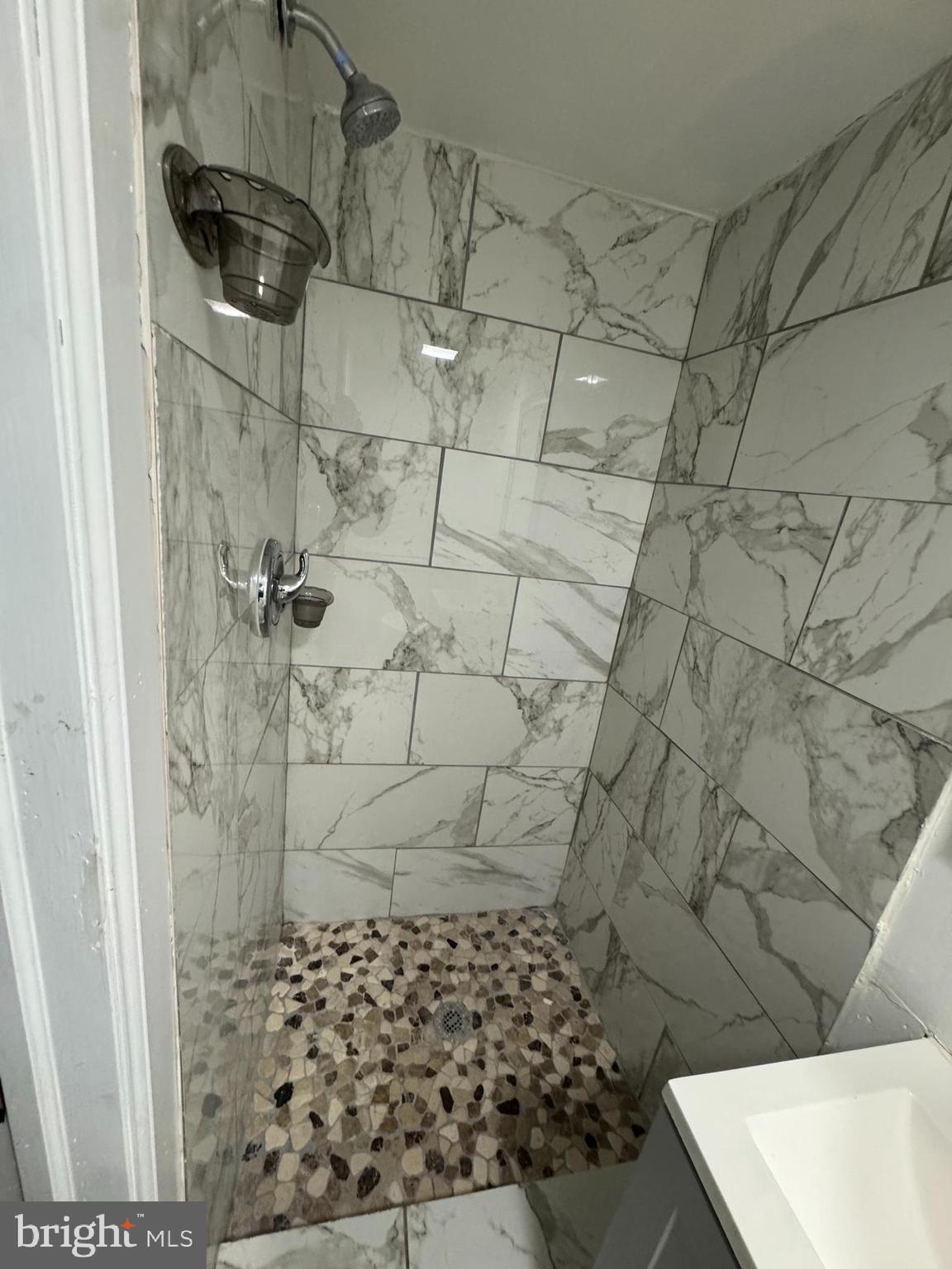 418 Stemmers Run Road Essex, MD 21221 - Photo 11 of 23 a bathroom with a shower