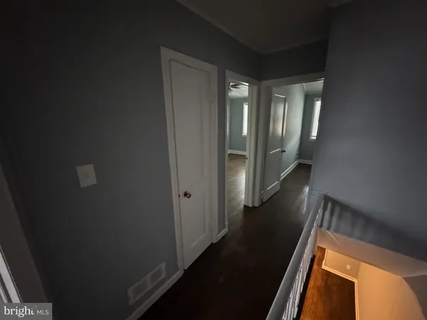 wooden floor in an empty room and a window