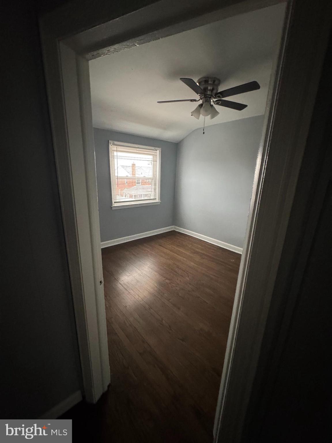 418 Stemmers Run Road Essex, MD 21221 - Photo 15 of 23 wooden floor in an empty room and a window