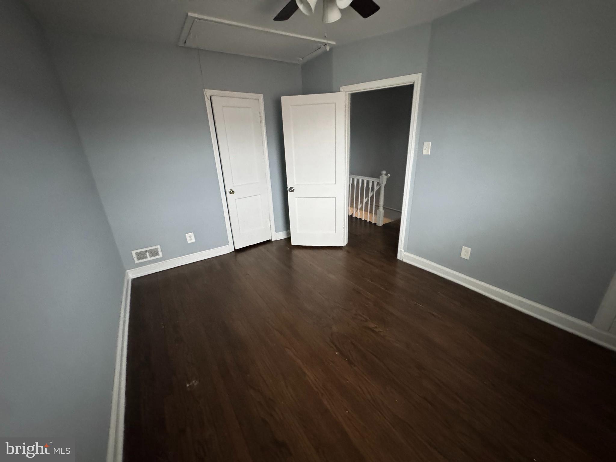 418 Stemmers Run Road Essex, MD 21221 - Photo 16 of 23 an empty room with wooden floor and closet