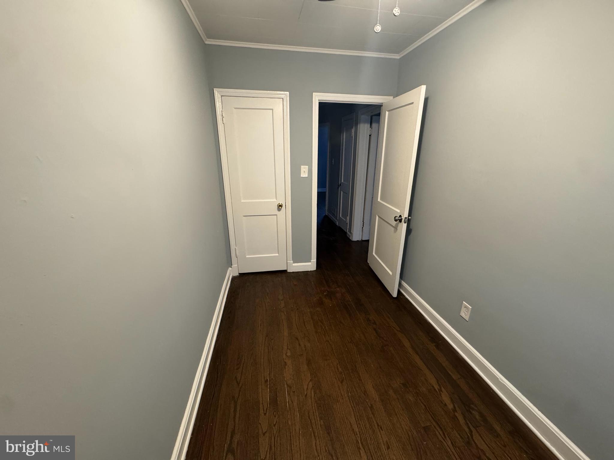 418 Stemmers Run Road Essex, MD 21221 - Photo 22 of 23 a view of a hallway with wooden floor and staircase