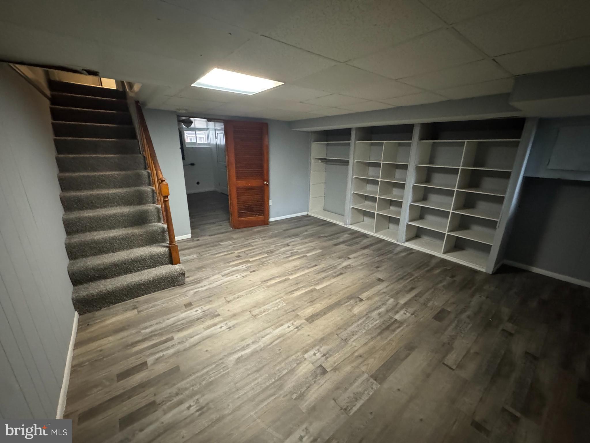 418 Stemmers Run Road Essex, MD 21221 - Photo 8 of 23 a view of an empty room with a staircase