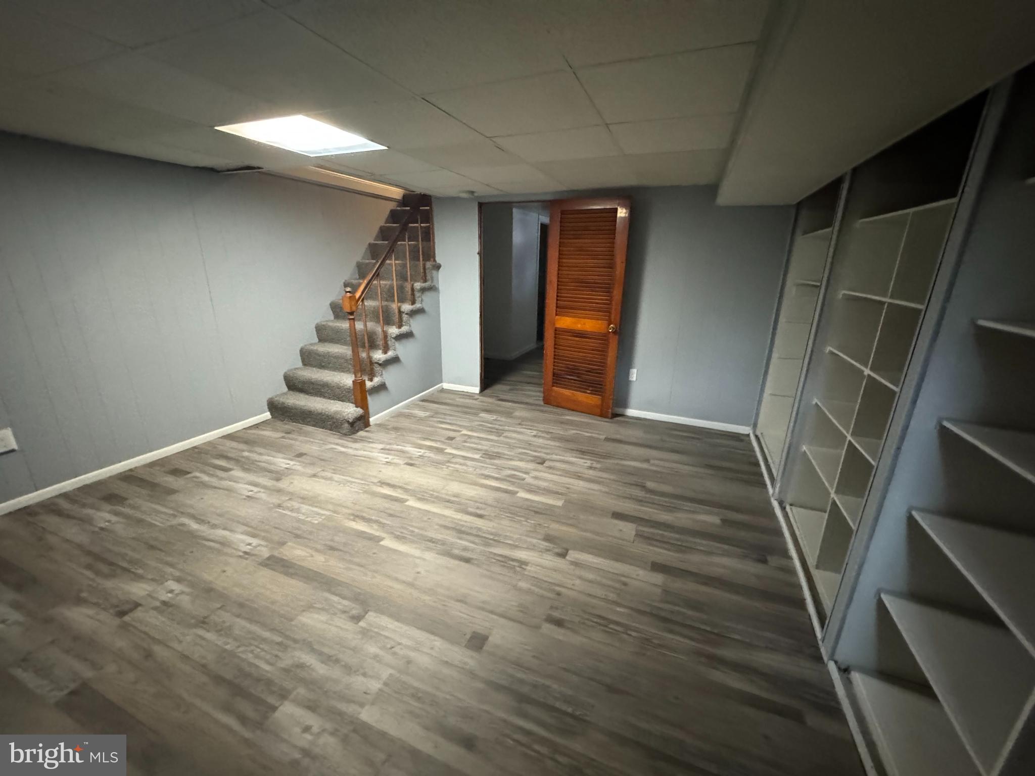 418 Stemmers Run Road Essex, MD 21221 - Photo 9 of 23 a view of an empty room with stairs and ventilation