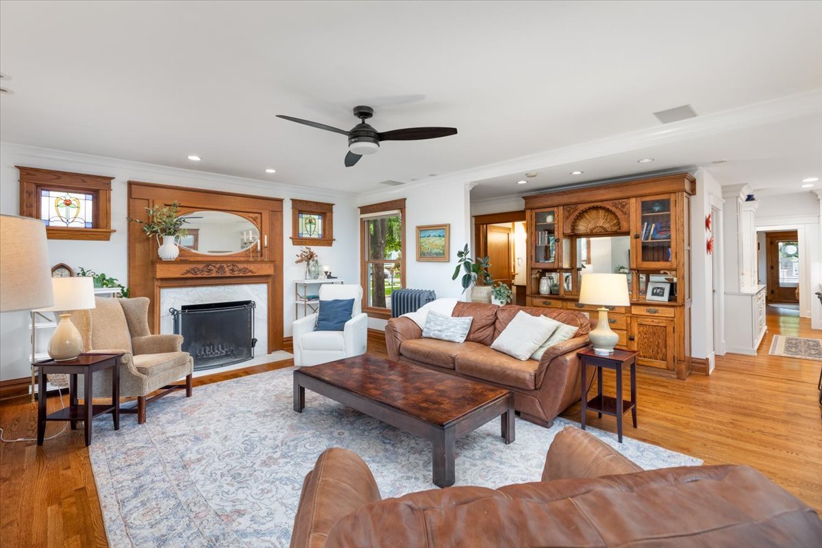 23 Columbia Street Naperville, IL 60540 - Photo 29 of 94 a living room with furniture a fireplace and a large window