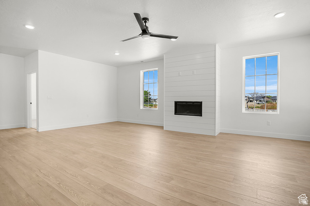 1631 West Century Lane, Unit C Mapleton, UT 84664 - Photo 6 of 31 Spacious interior room featuring light wood-finish flooring, recessed lighting, and a modern ceiling fan