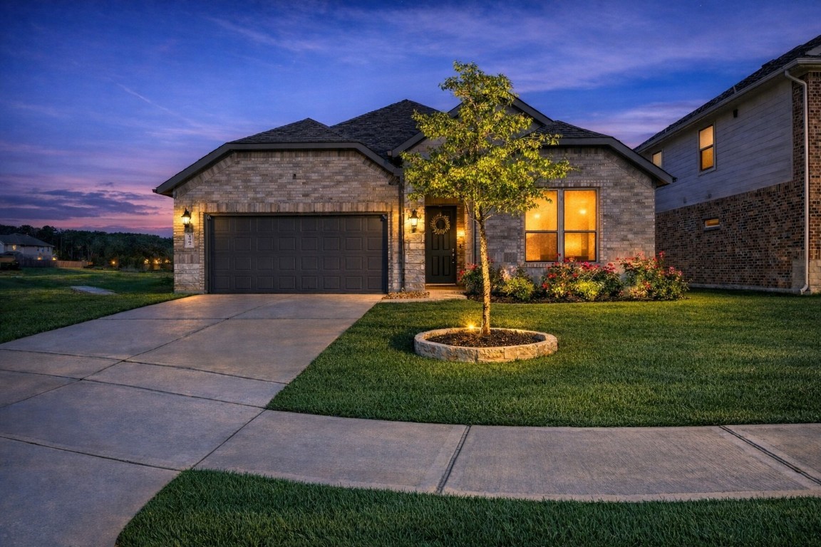 1507 Oakdale Crest Road Montgomery, TX 77316 - Photo 1 of 23 a front view of a house with garden and plants